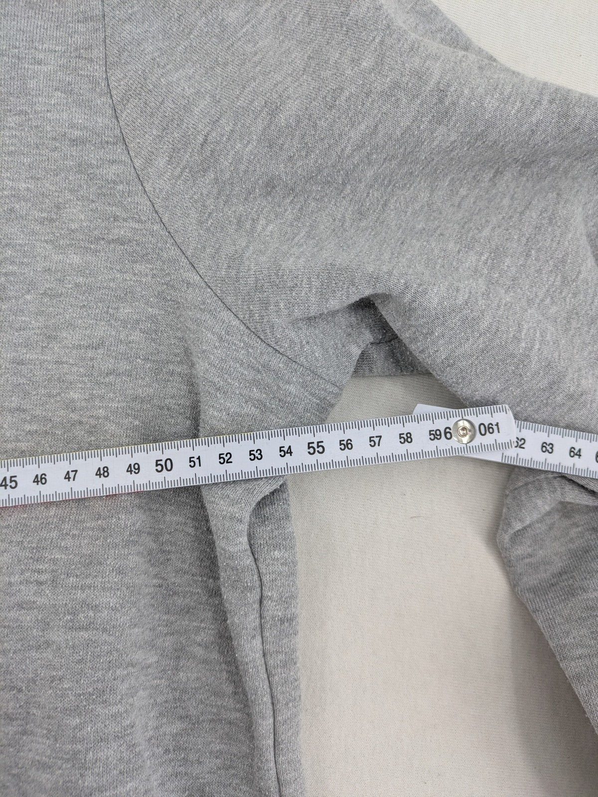 Primark grey zip-through hoodie featuring yellow Smiley logo and Nevermind graphic.