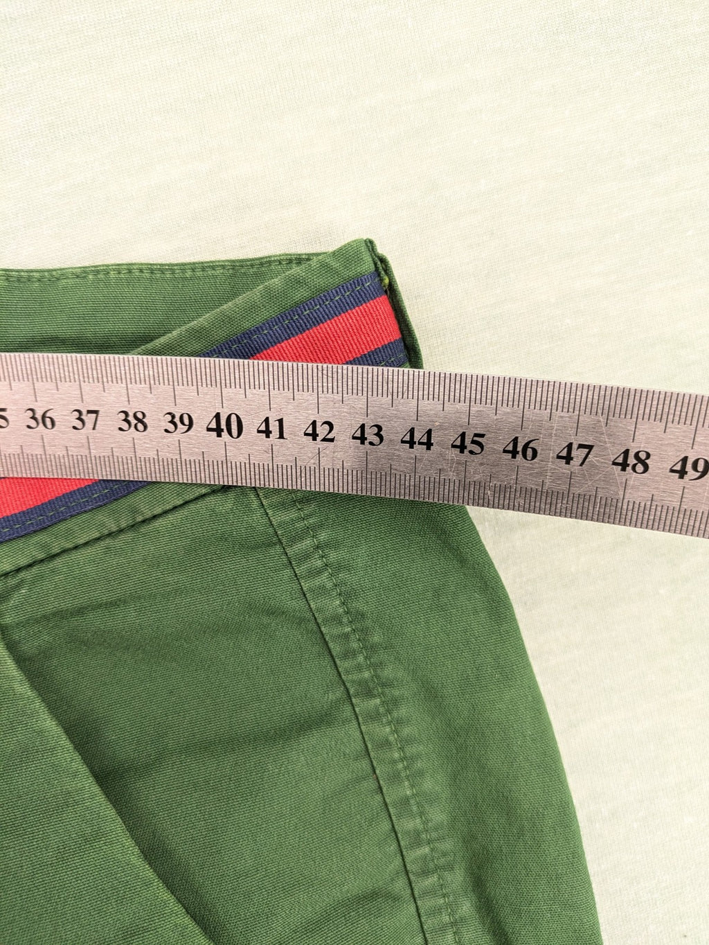 Mason's green chino pants with striped red and blue waistband, cotton stretch material.