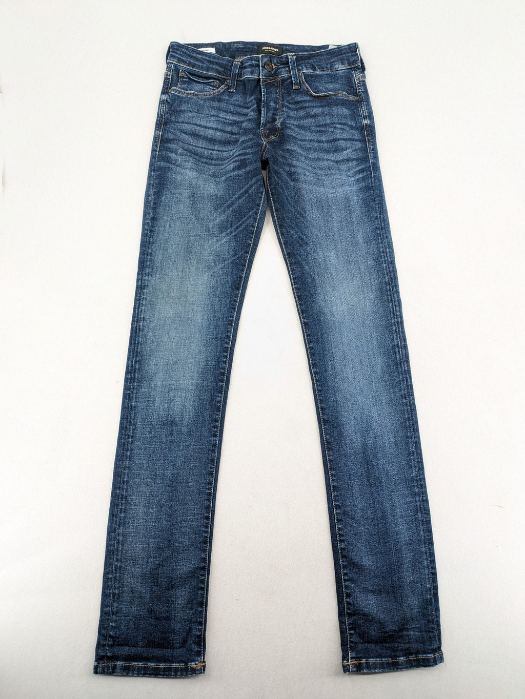 Jack & Jones blue slim fit jeans with faded wash and classic button fly.