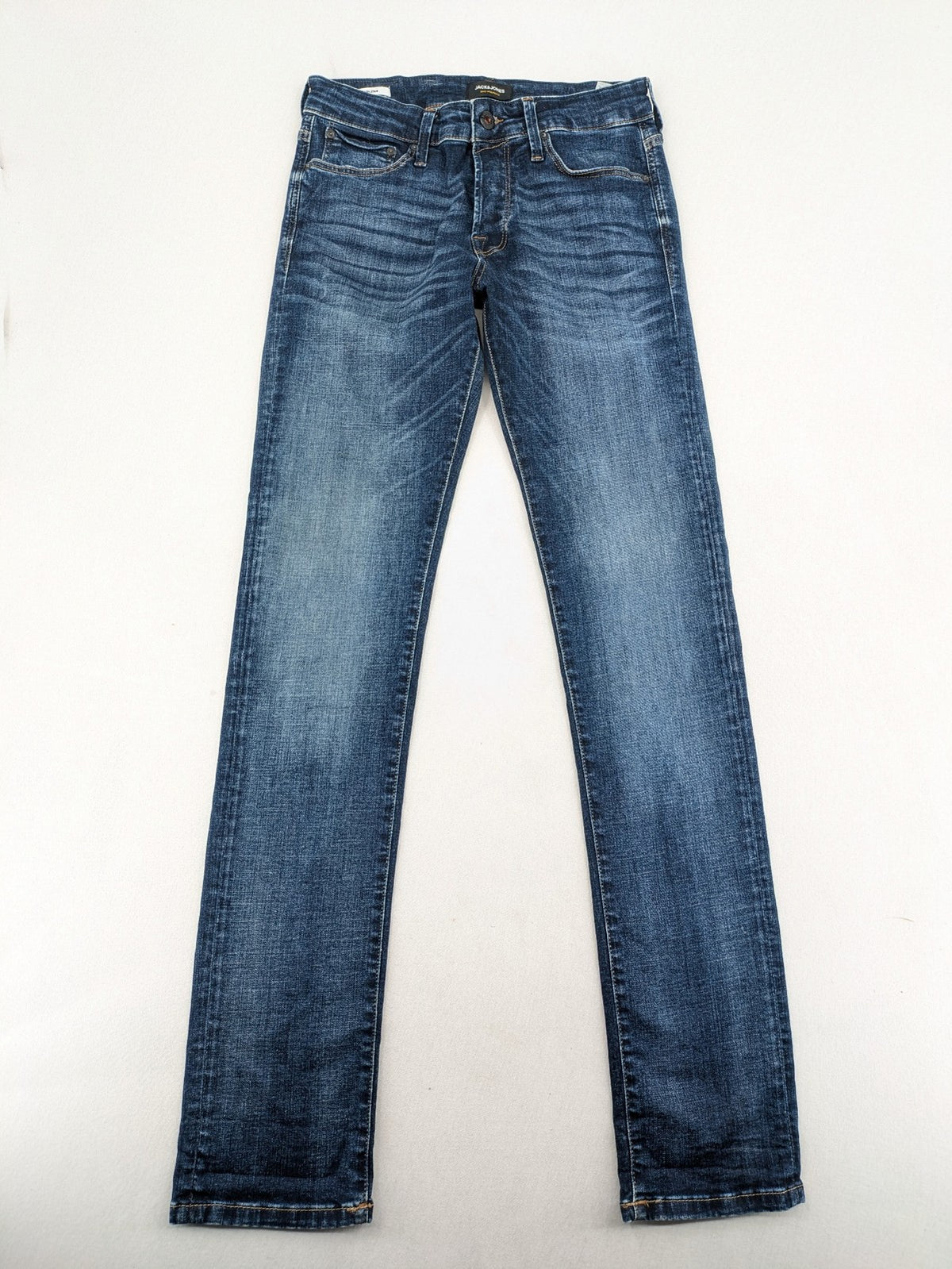 Jack & Jones blue slim fit jeans with faded wash and classic button fly.
