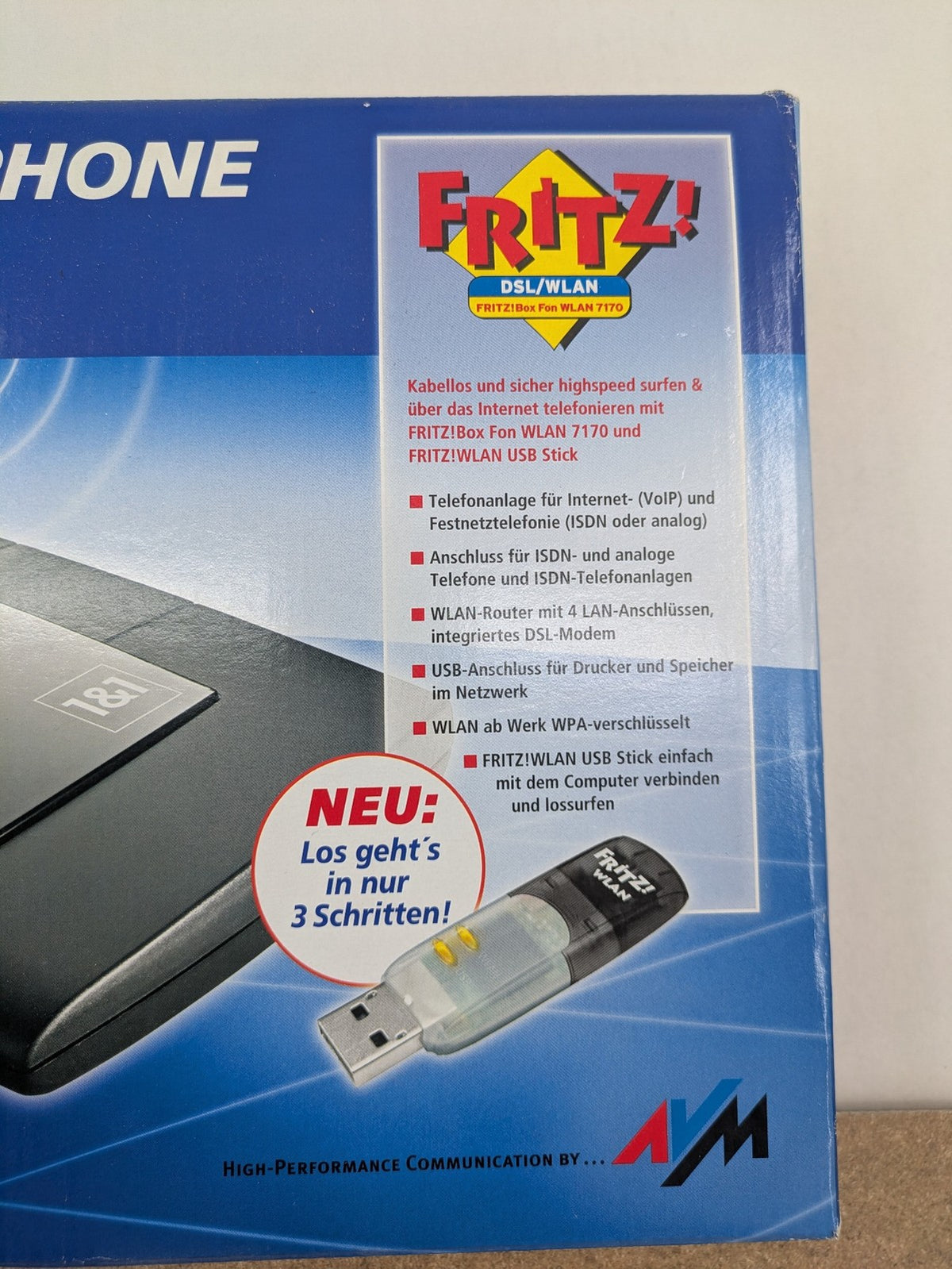 AVM VoIP gateway router blue with integrated DSL modem and phone system features.