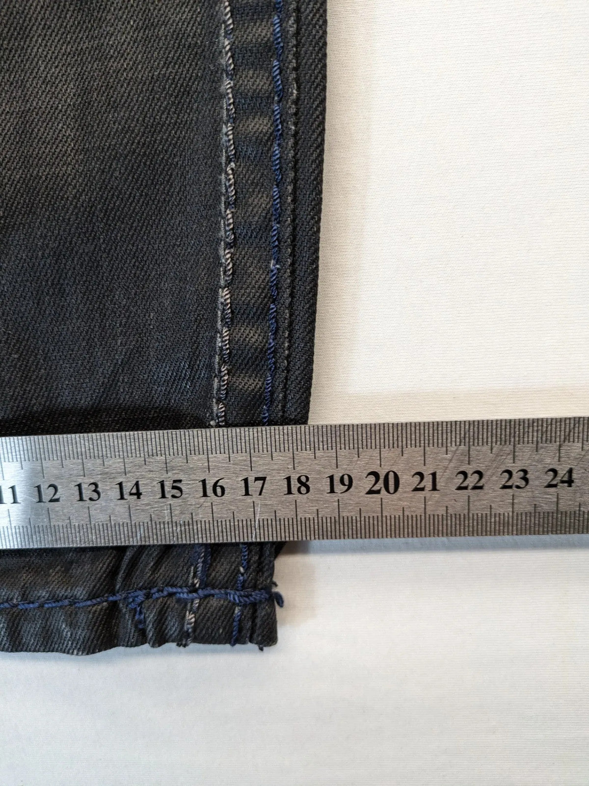 Fadnoble grey straight jeans with button fly and contrasting stitching details.