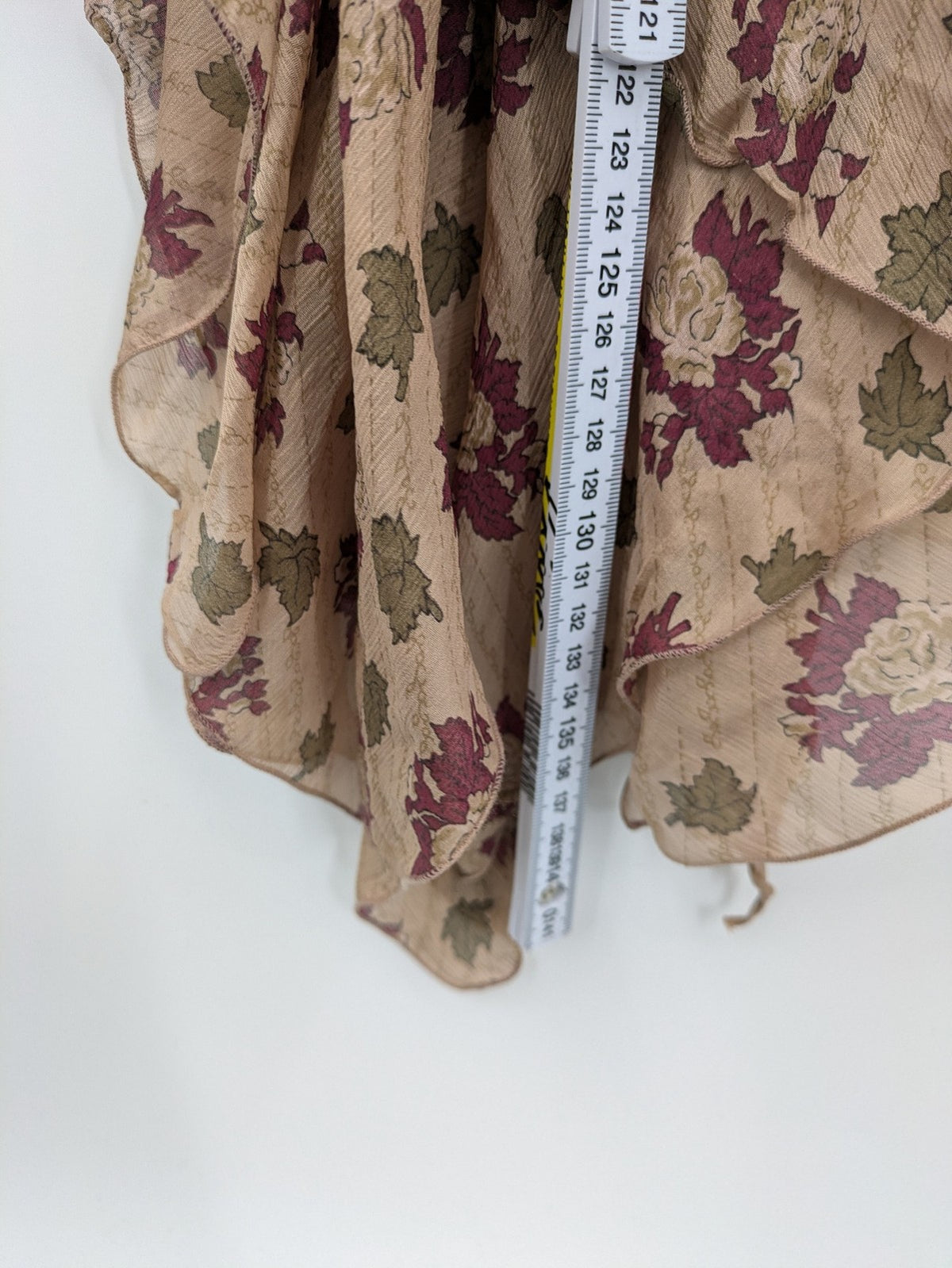 Zara Woman beige bridal party dress with floral pattern and asymmetrical ruffle details.