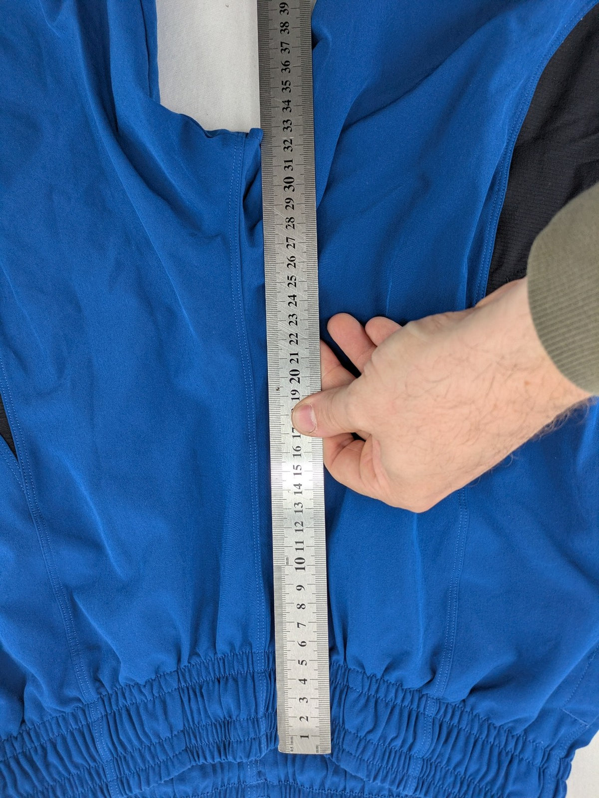 Under Armour blue HeatGear joggers with black accents and zippered cargo pockets.