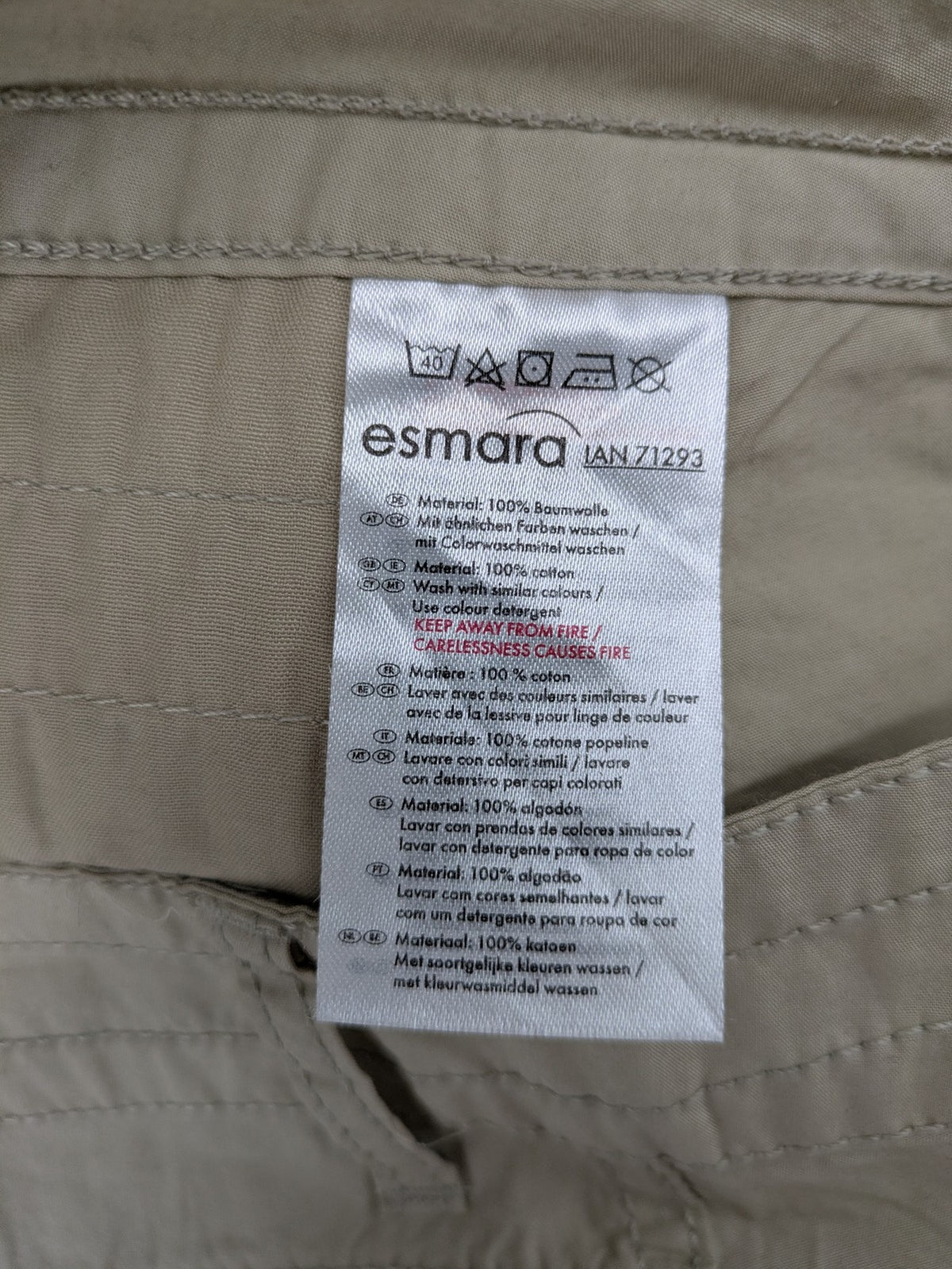 ESMARA beige cargo mini skirt with utility pockets and classic zipper button closure.
