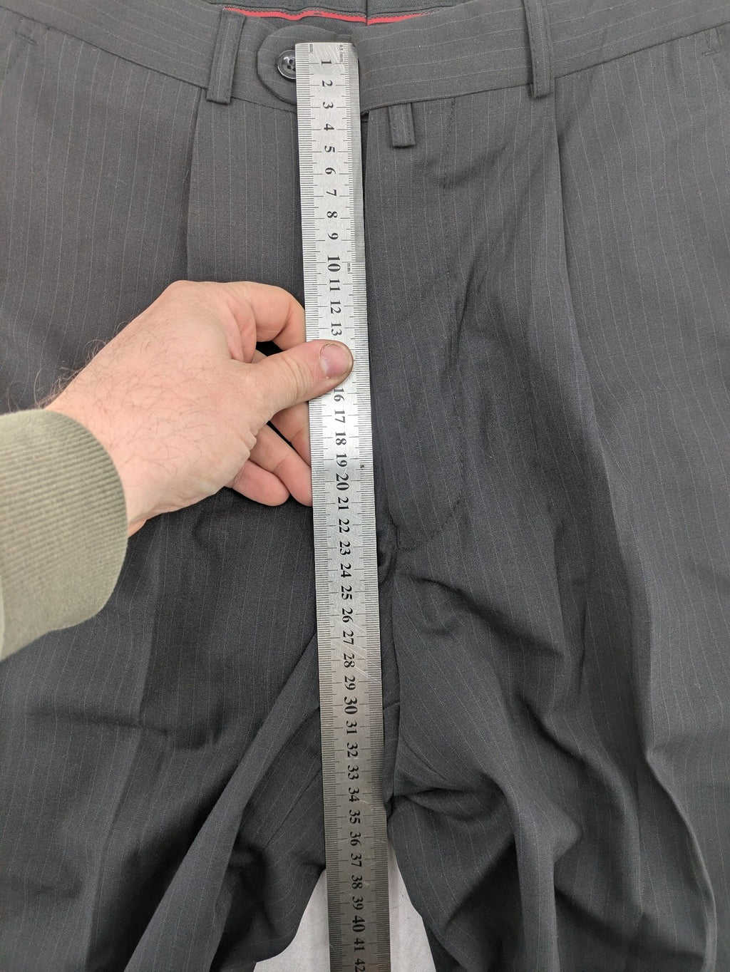 Wahl grey dress pants with pinstripe pattern and pleats, featuring side and back pockets.