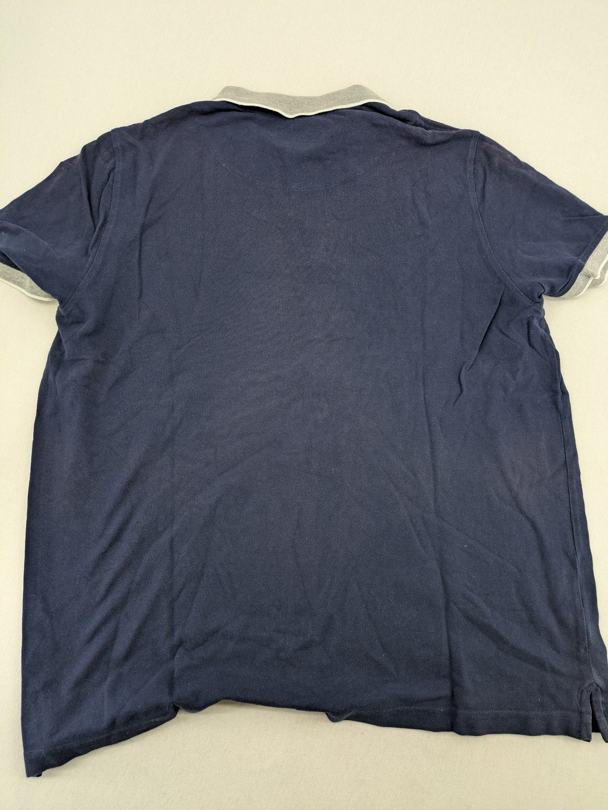XXL navy polo shirt with grey contrast collar and cuffs, 100% cotton material.