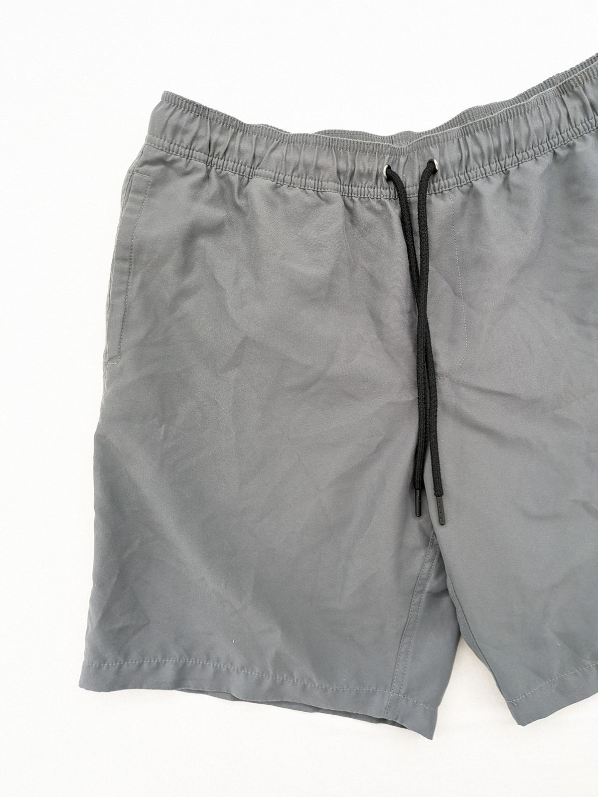 Amazon Essentials grey swim shorts with adjustable drawstring, side pockets, and quick-dry material.