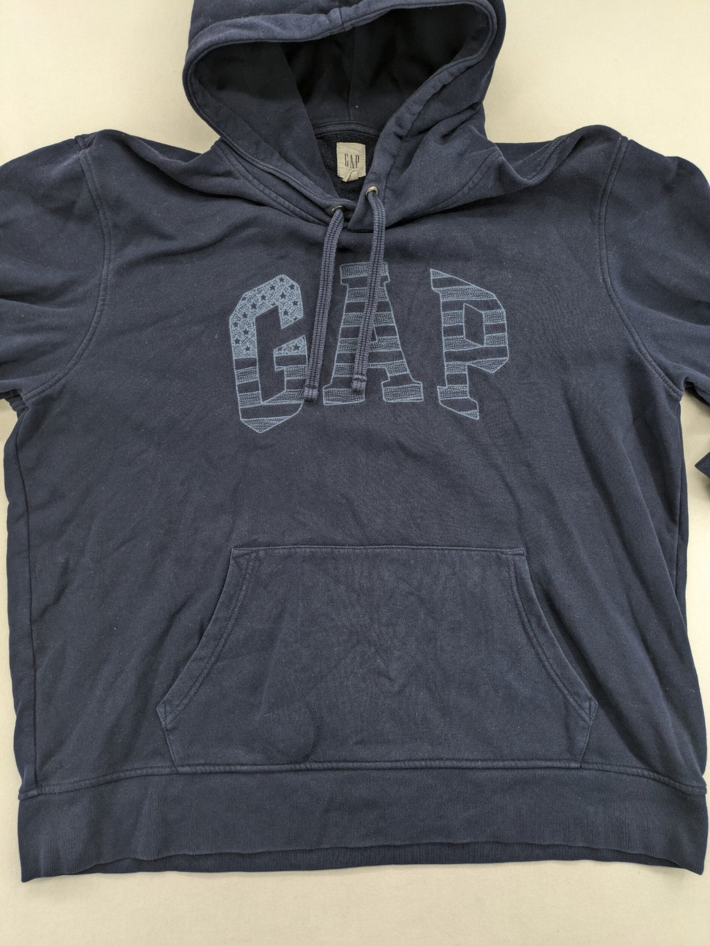 Gap zip-through hoodie navy blue with iconic logo and American flag graphic.