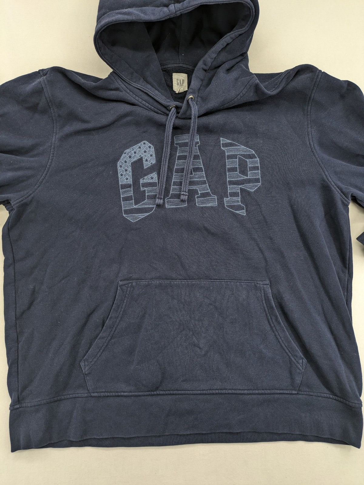 Gap zip-through hoodie navy blue with iconic logo and American flag graphic.