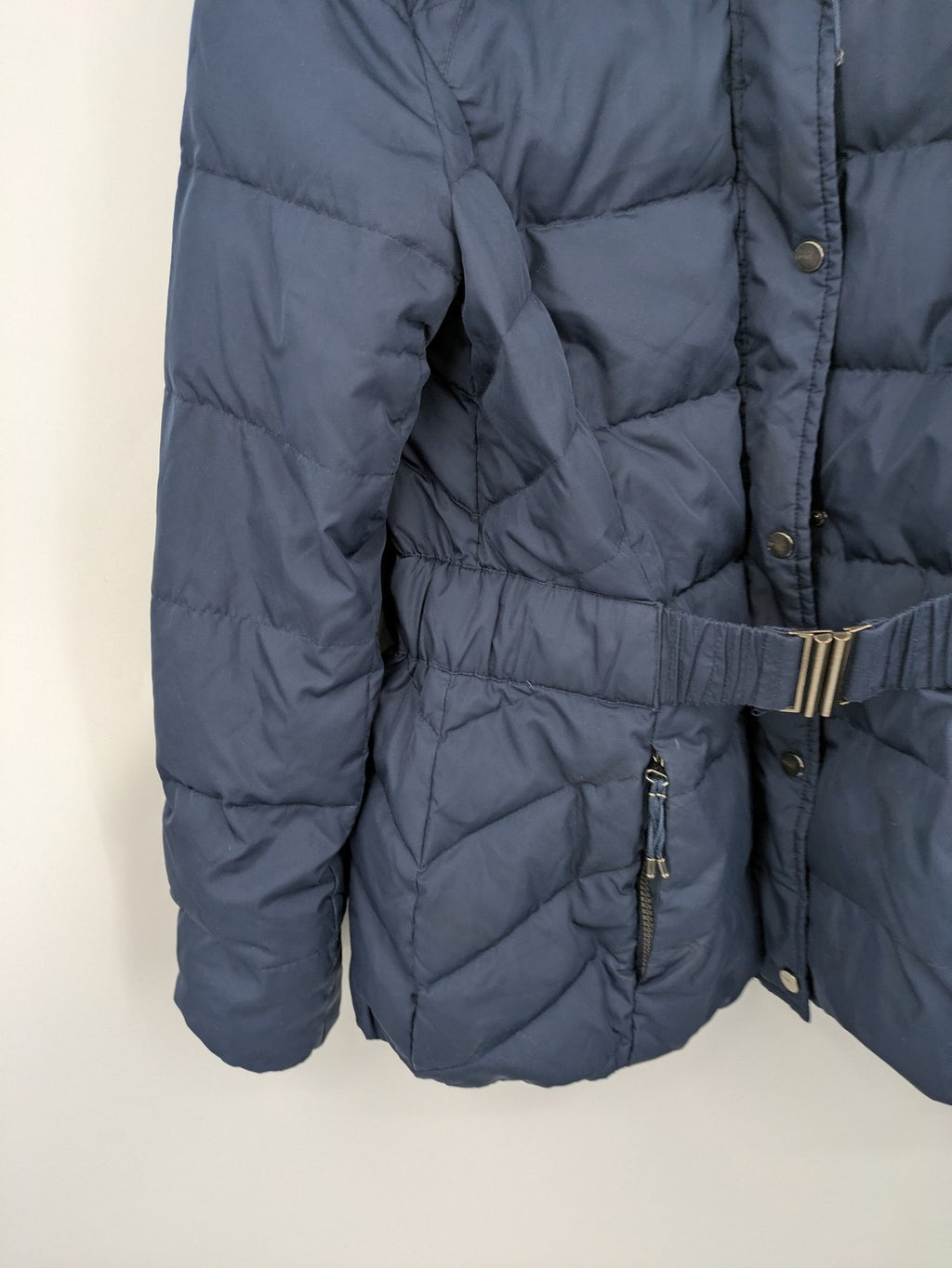 Esprit navy puffer jacket with belt, high collar, ribbed inner lining, and button placket.