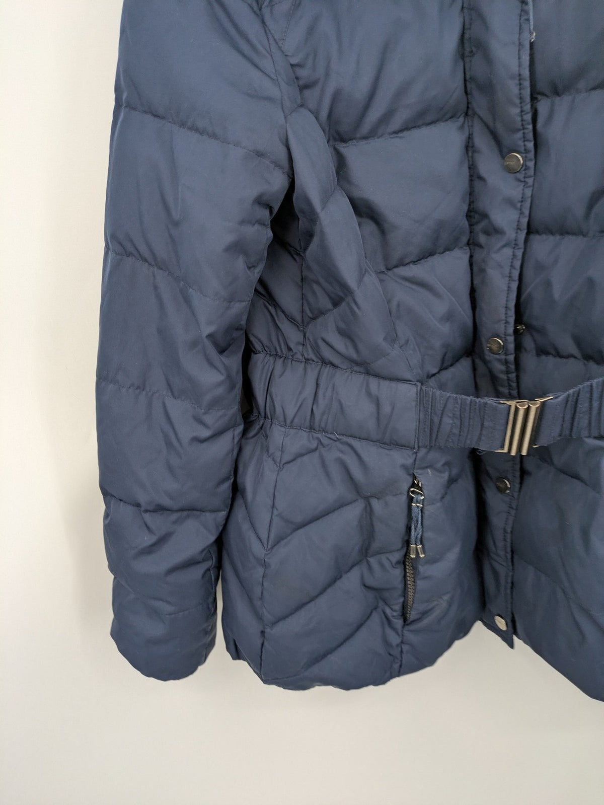 Esprit navy puffer jacket with belt, high collar, ribbed inner lining, and button placket.