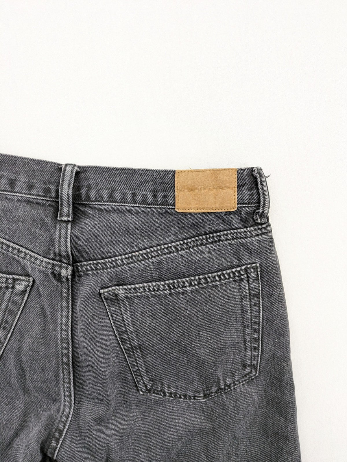 Weekday grey straight jeans with button fly and classic denim design.