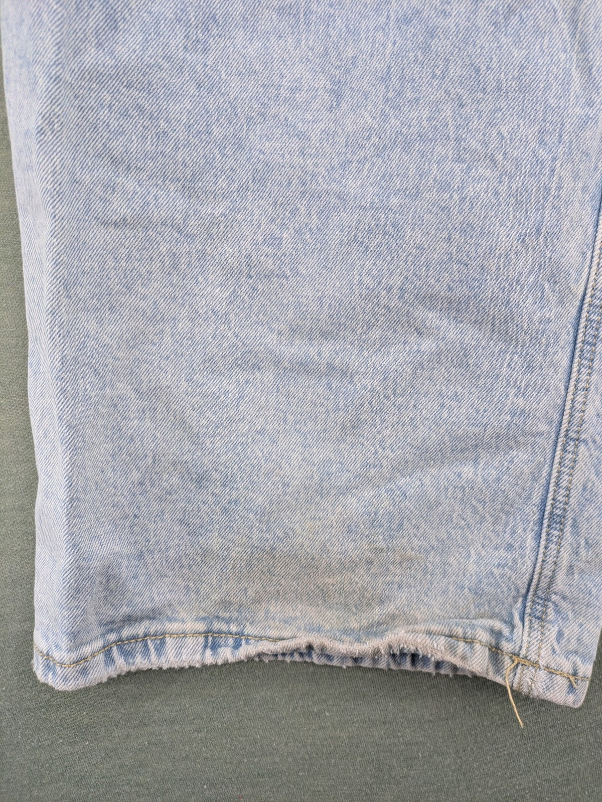 C&A blue wide leg jeans with distressed knee details and classic five-pocket design.