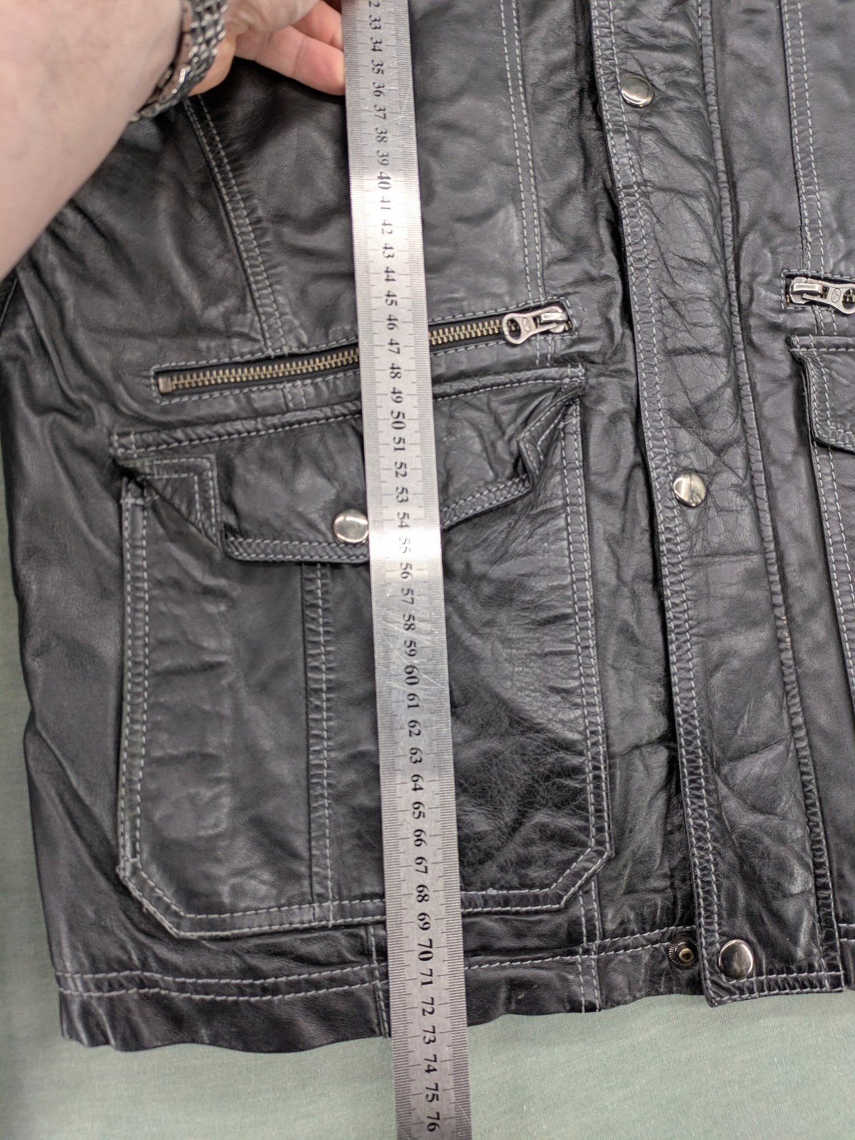 Tom Tailor black leather jacket vintage style with multiple pockets and contrast stitching.