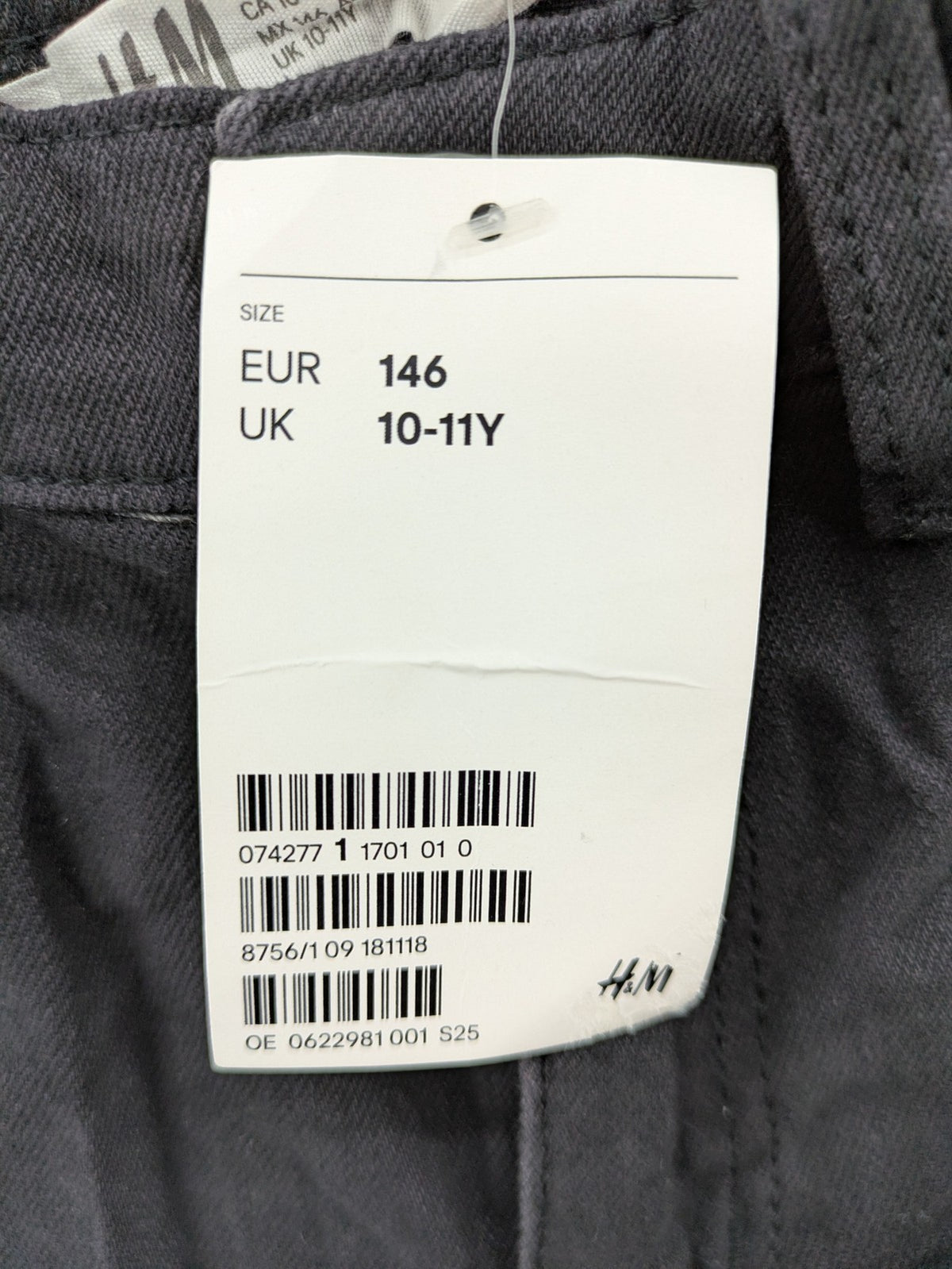 H&M grey skinny fit stretch jeans with modern design and durable denim material.