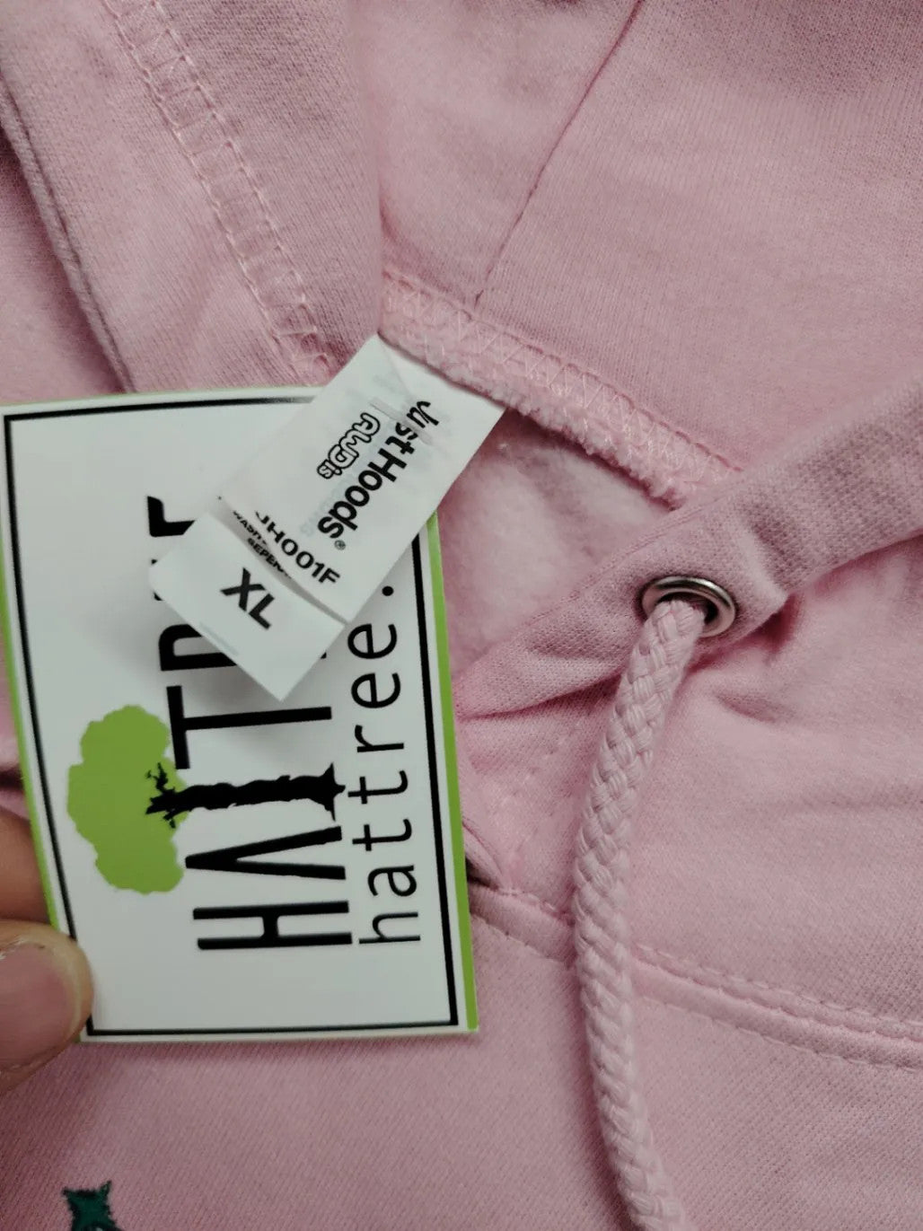 Just Hoods pink zip-through hoodie with "Trinkerbell" graphic, kangaroo pocket, drawstring hood.