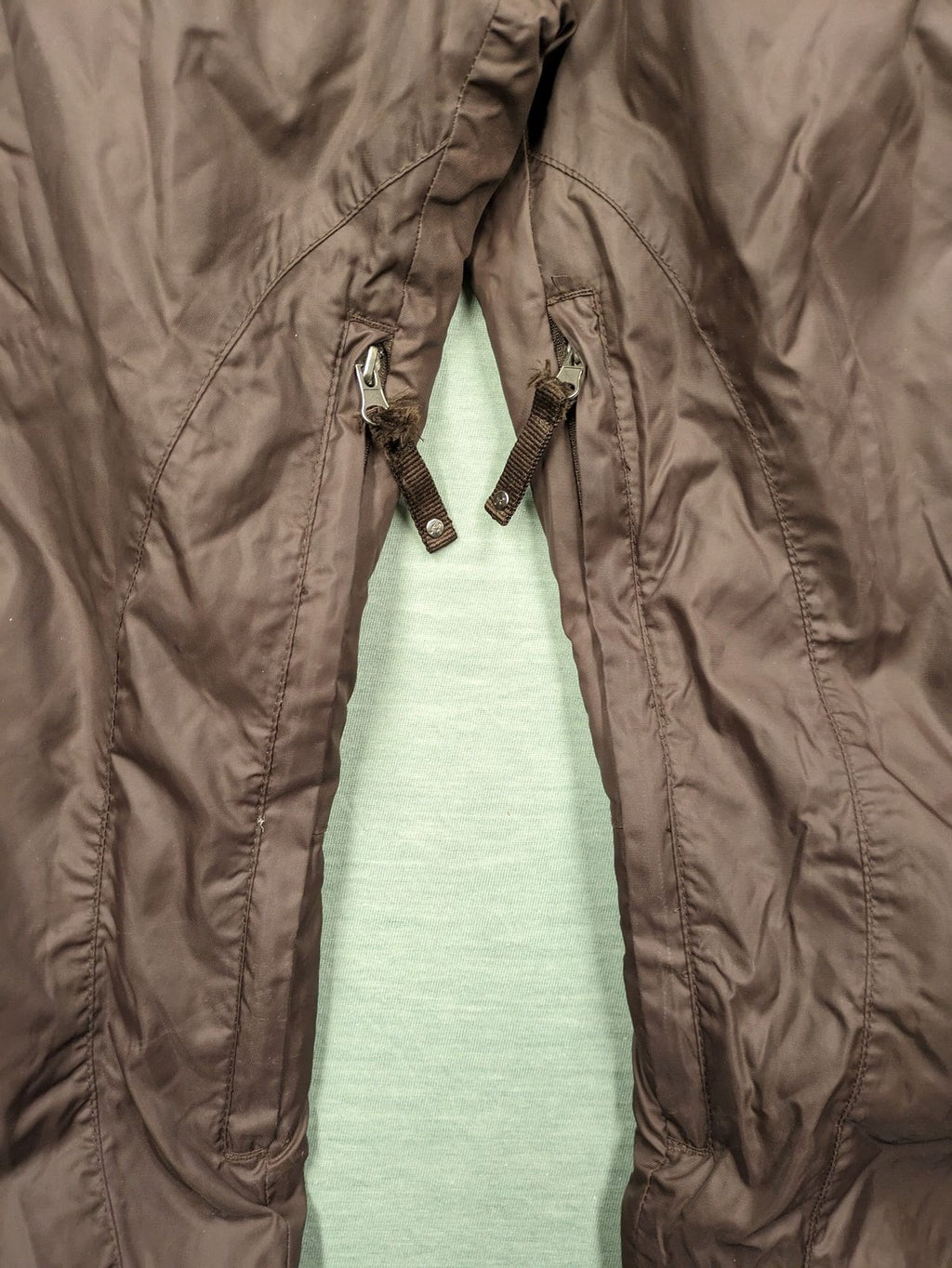 Thinsulate black and blue ski jumpsuit with hood and zippered pockets.