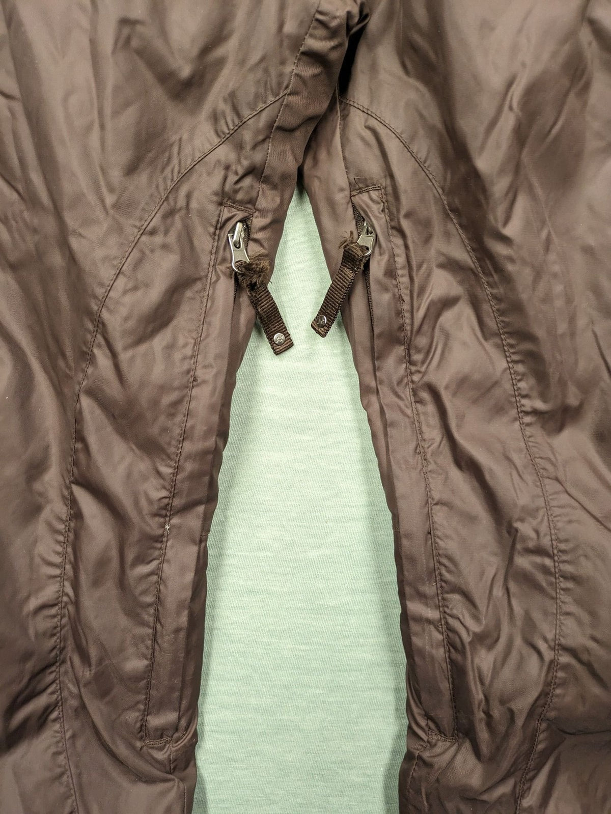 Thinsulate black and blue ski jumpsuit with hood and zippered pockets.