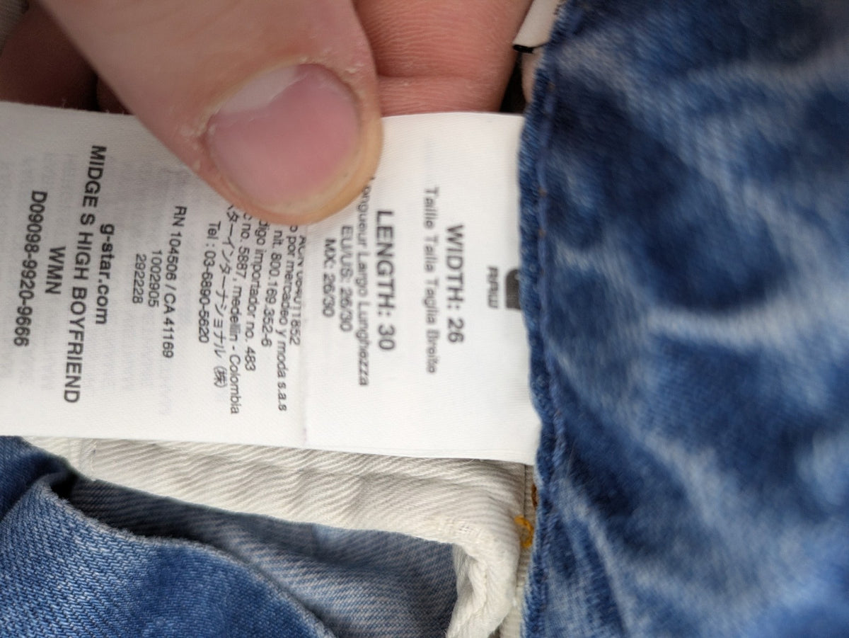 G-Star Raw blue distressed high boyfriend jeans with ripped details and classic button closure.