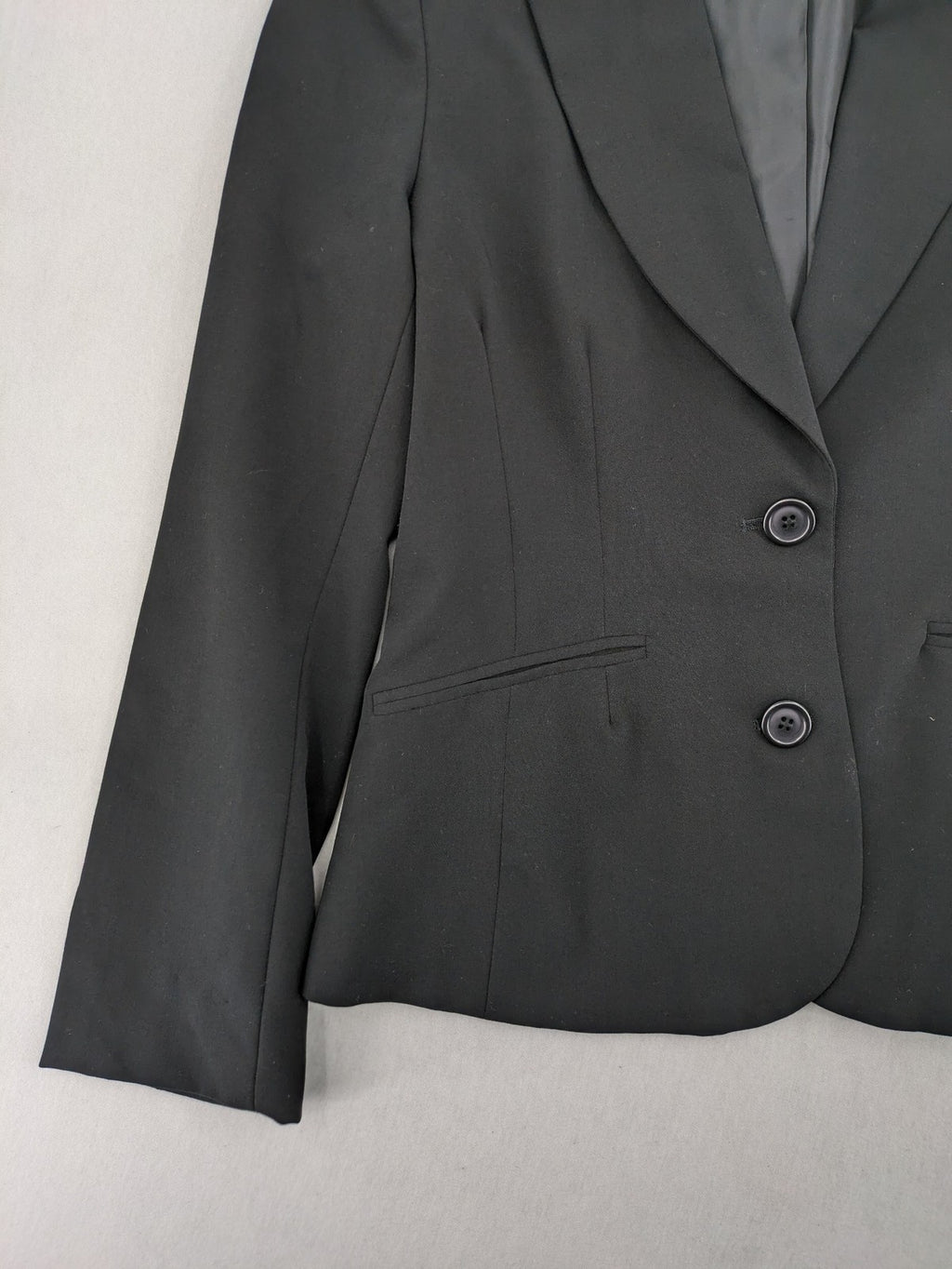 Lindex black blazer coat two-button design with subtle embroidery and tailored silhouette.