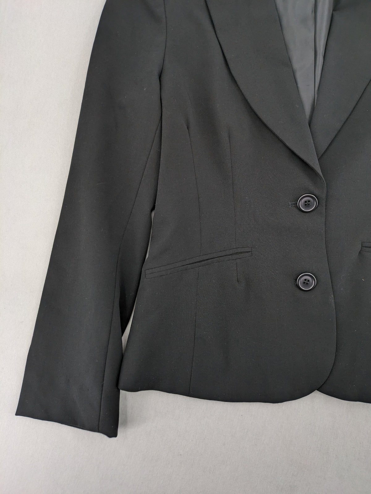 Lindex black blazer coat two-button design with subtle embroidery and tailored silhouette.