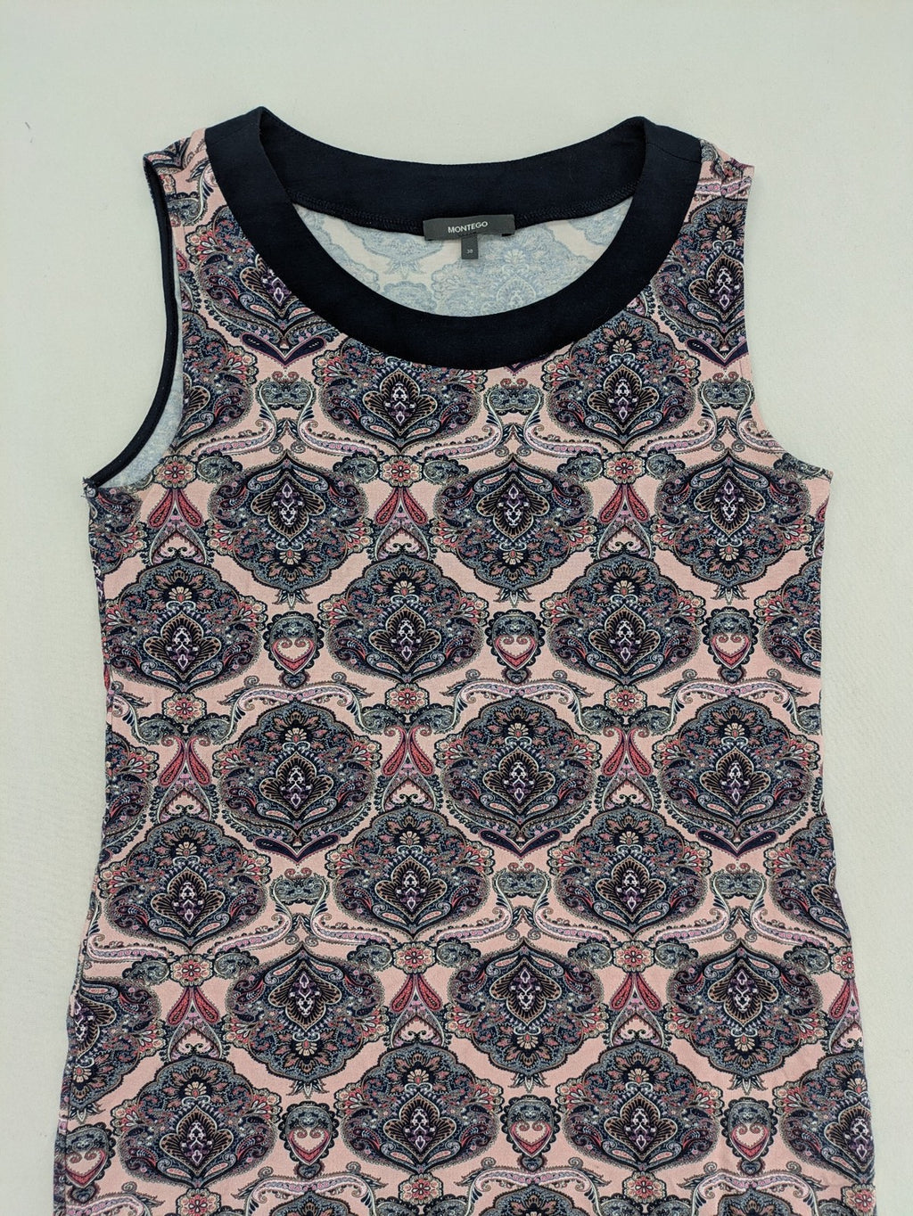 Montego pink sleeveless dress with paisley pattern and black hem, made of viscose.