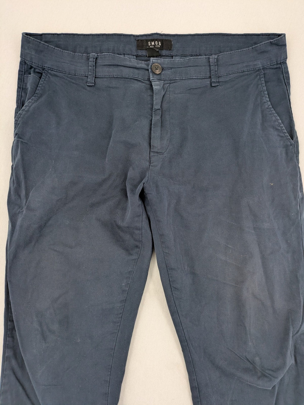 smog blue chino pants with belt loops, button fly, and side pockets