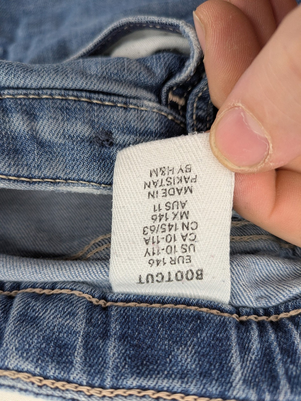 H&M blue bootcut jeans size 146, medium wash, stretch denim material.