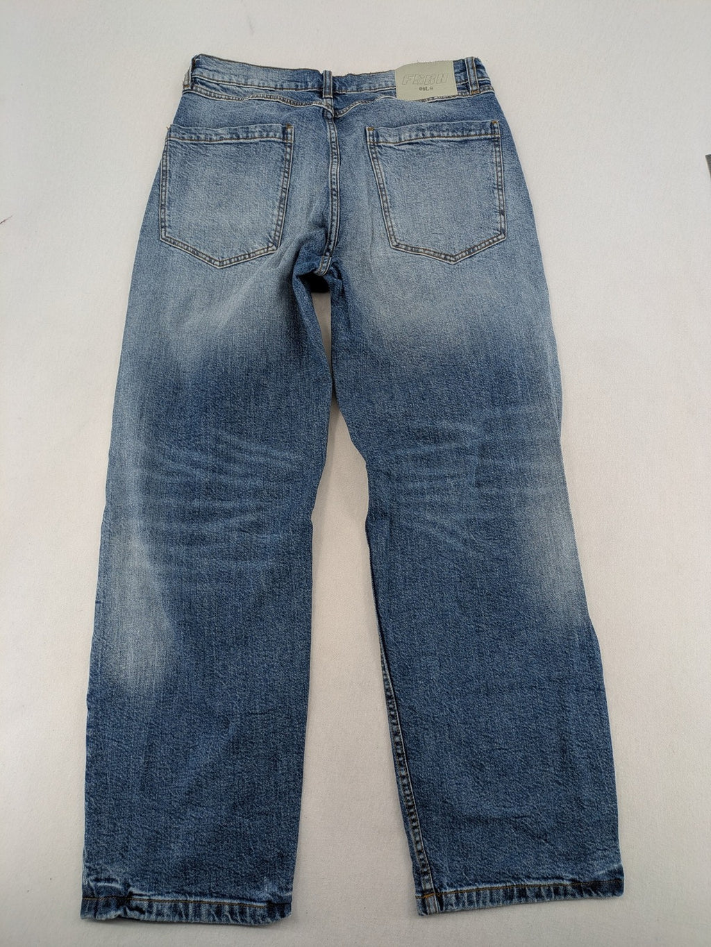 FSBN blue straight jeans with ripped distressed knees and classic button fly.
