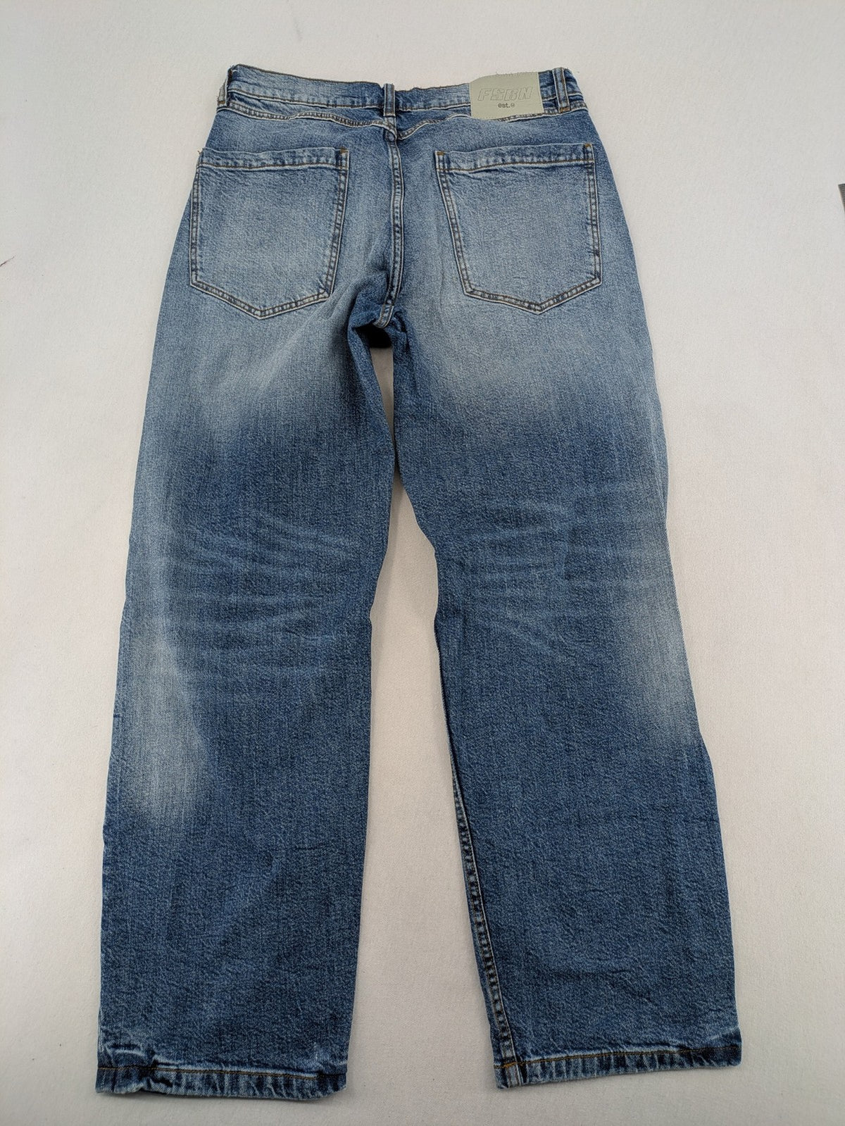 FSBN blue straight jeans with ripped distressed knees and classic button fly.