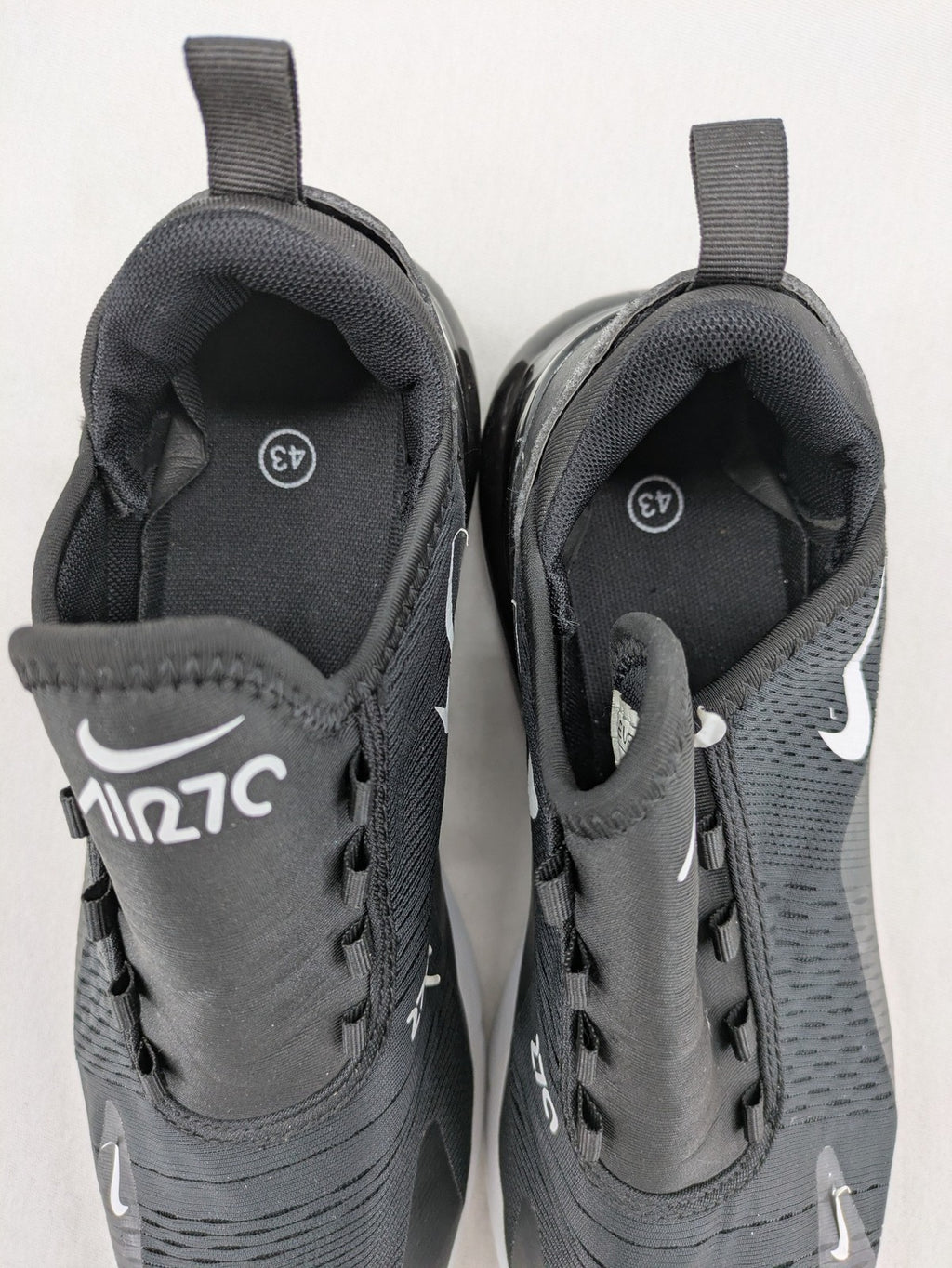 Nike Air Max 270 black and grey sneakers with large Air unit and white accents