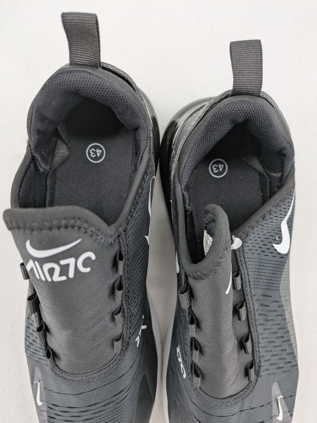 Nike Air Max 270 black and grey sneakers with large Air unit and white accents